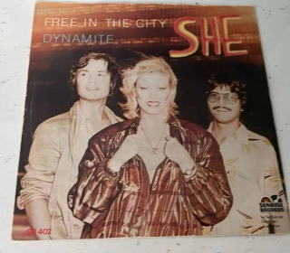 SP SHE : Free in The city / Dynamite